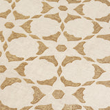 Fabric yardage in a floral lattice print in bronze on a cream field.