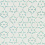 Fabric in a floral lattice print in turquoise on a white field.