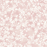 Detail of wallpaper in a painterly branch print in white on a pink watercolor field.