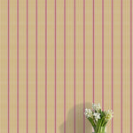 Striped wallpaper with a vase of flowers on a flat surface