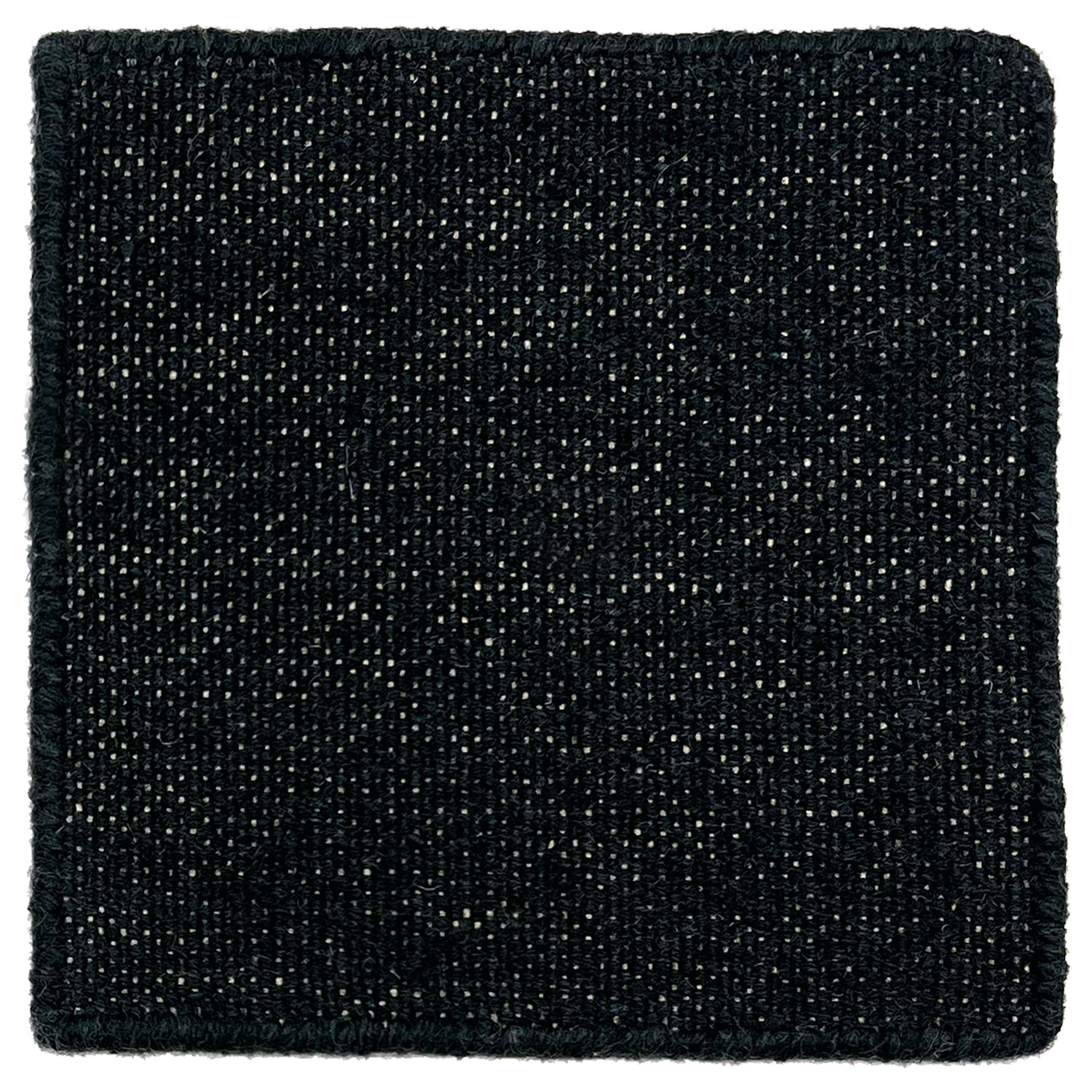 Flatweave durrie sample in black on a white warp. 