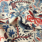 Fabric with red, blue, and  pink marine-themed pattern