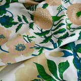 Floral fabric with green leaves and pink flowers on a white background