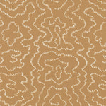 Detail of wallpaper in a minimalist wood grain print in cream on a tan field.