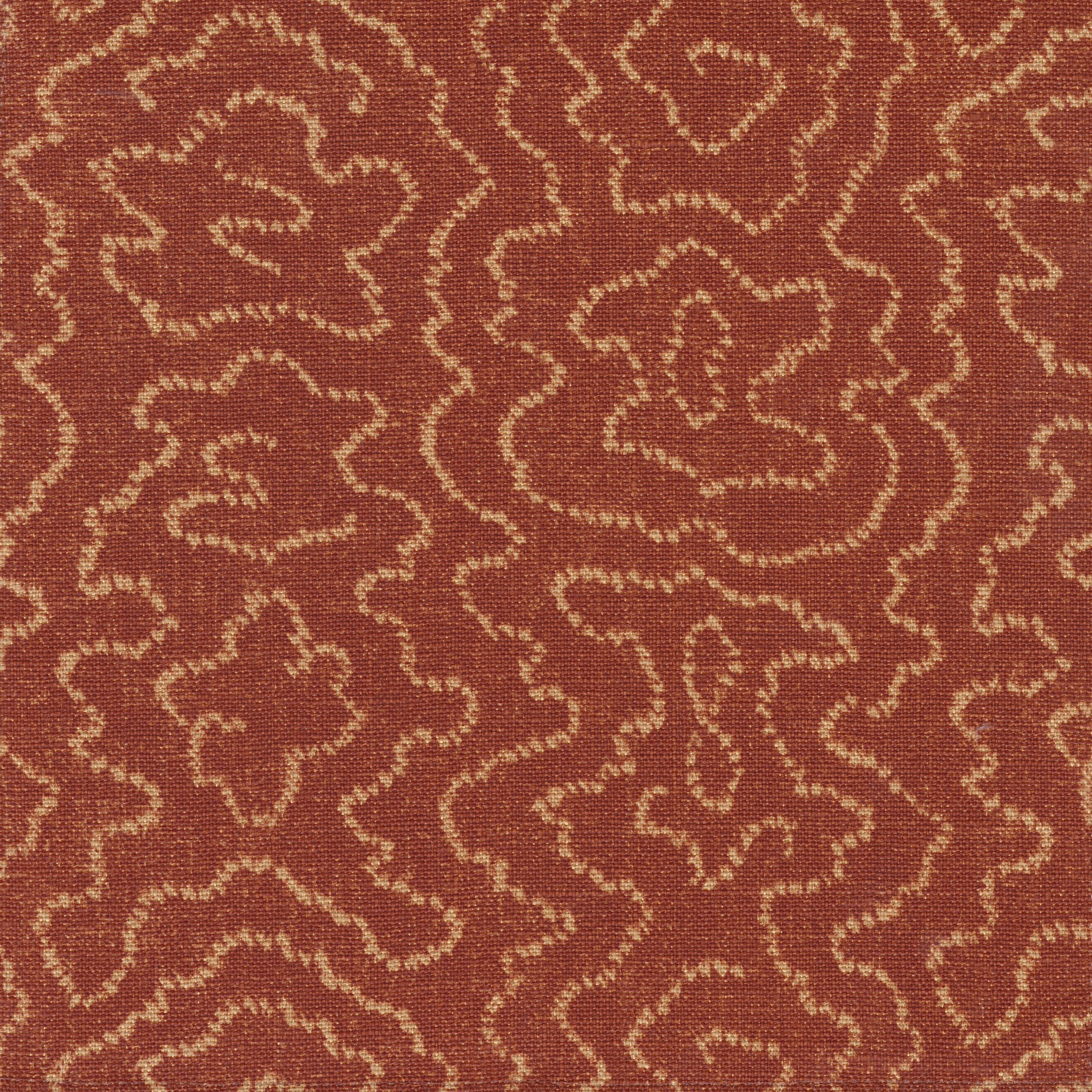 Detail of fabric in a minimalist wood grain print in tan on a rust field.