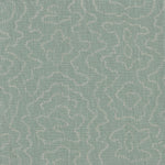 Detail of fabric in a minimalist wood grain print in gray on a pastel turquoise field.
