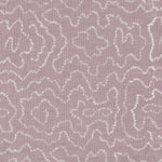 Detail of fabric in a minimalist wood grain print in white on a lavender field.