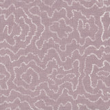 Detail of fabric in a minimalist wood grain print in white on a lavender field.