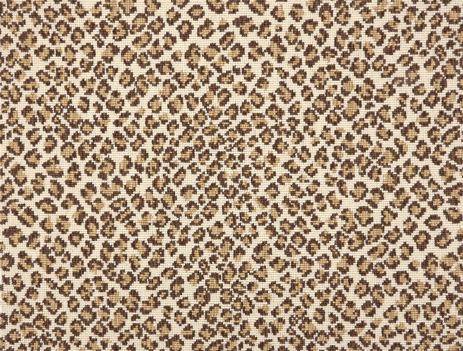 A close-up of a leopard print broadloom in brown and tan spots on a cream background.