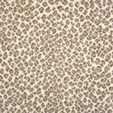 A close-up of a leopard print broadloom in beige and tan spots on a cream background.