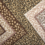Broadloom carpet with subtle animal print in a range of neutral colors. 