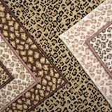 Broadloom carpet with subtle animal print in a range of neutral colors. 