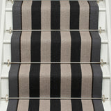 Striped flatweave runner in black and white on white staircase