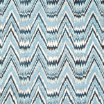 Detail of fabric in a dense chevron stripe print in shades of navy, blue and cream.