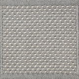 Close-up of woven carpet with a grid pattern in gray and white.