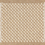 Close-up of woven carpet with a grid pattern tan and white.