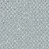 Detail of wallpaper in a painterly checked pattern in shades of blue and white.