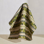 Hanging fabric in a complex stripe with geometric shapes and chevrons in sage, olive ecru and cream.