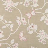 Detail of fabric in a flower and butterfly print in cream and pink on a tan field.