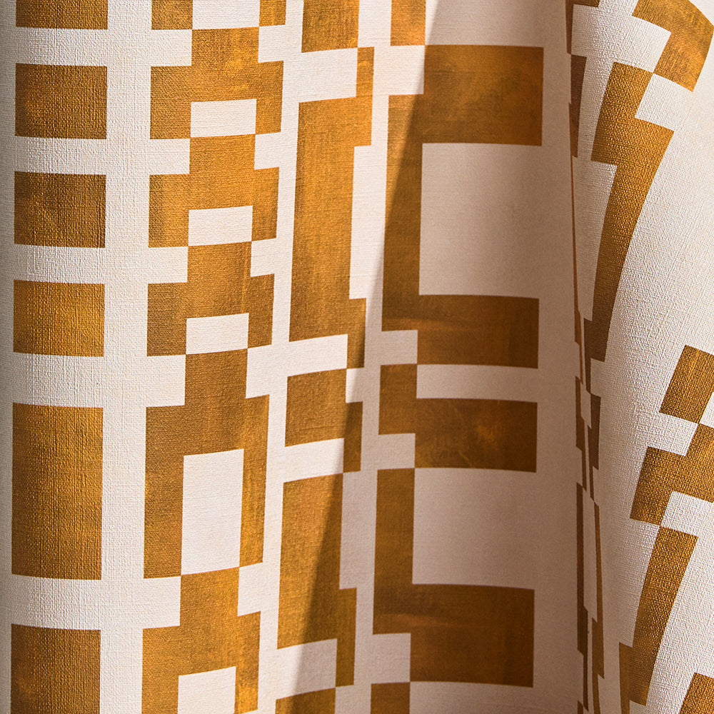Wallpaper in a modernist checkerboard pattern in yellow ochre and cream.