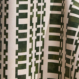 Wallpaper in a modernist checkerboard pattern in hunter green and cream.