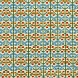 Patterned fabric with a gridded floral design in green, orange and blue. 