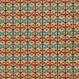 Patterned fabric with a gridded floral design in blue, orange and brown. 