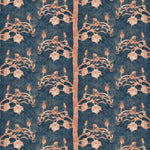 Detail of wallpaper in a linear tree and leaf print in burnt orange on a navy field.