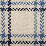 Broadloom carpet in a windowpane plaid in shades of blue on a beige field.