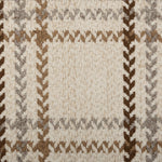 Broadloom carpet in a windowpane plaid in shades of brown on a beige field.