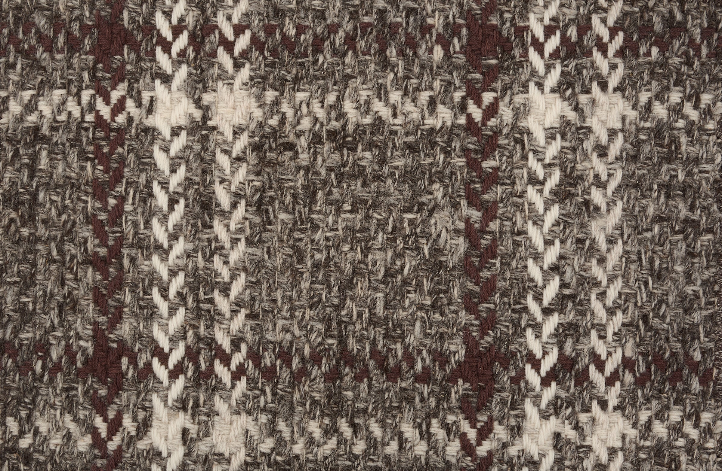 Broadloom carpet in a windowpane plaid in brown and cream on heather brown field.