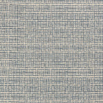 Detail of a linen fabric in a repeating abstract gridded pattern in navy on a cream field.