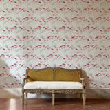 Decorative bench against a red and grey floral wallpapered wall