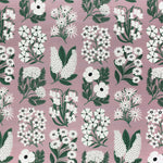 Detail of fabric in a minimalist floral grid print in white and green on a light purple field.