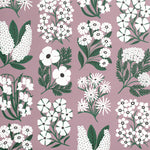 Detail of wallpaper in a minimalist floral grid print in white and green on a light purple field.