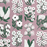 Detail of wallpaper in a minimalist floral grid print in white and green on a light purple field.