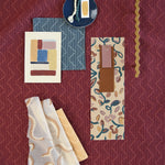Moodboard with layered swatches of fabrics and inspiration images in palette of red, yellow and pink,