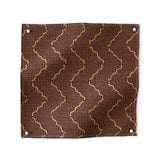 Pinned swatch of woven fabric with chevron stripe in brown
