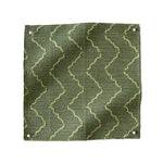Pinned swatch of woven fabric with chevron stripe in green. 