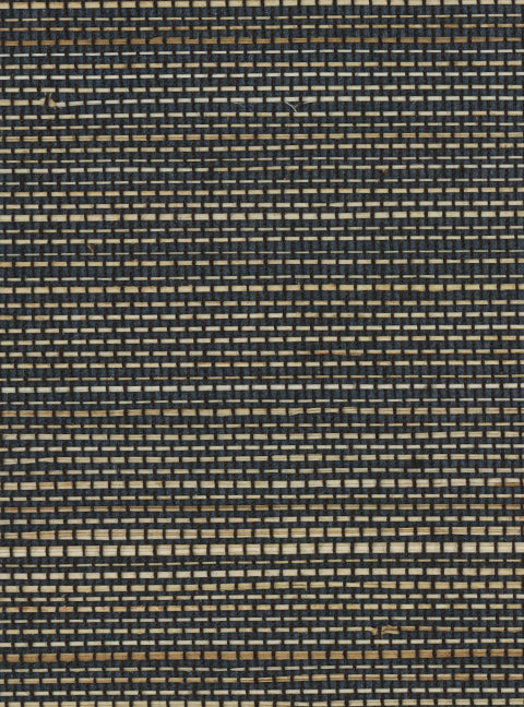 Detail of a grasscloth wallpaper panel with a textured weave in shades of grey, brown and black.