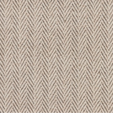 Broadloom carpet in a herringbone in cream and brown.