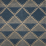 Handknotted rug in a geometric design in slate blue on a grey field. 
