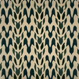 Handknotted rug in a petal pattern in shades of dark green on cream. 