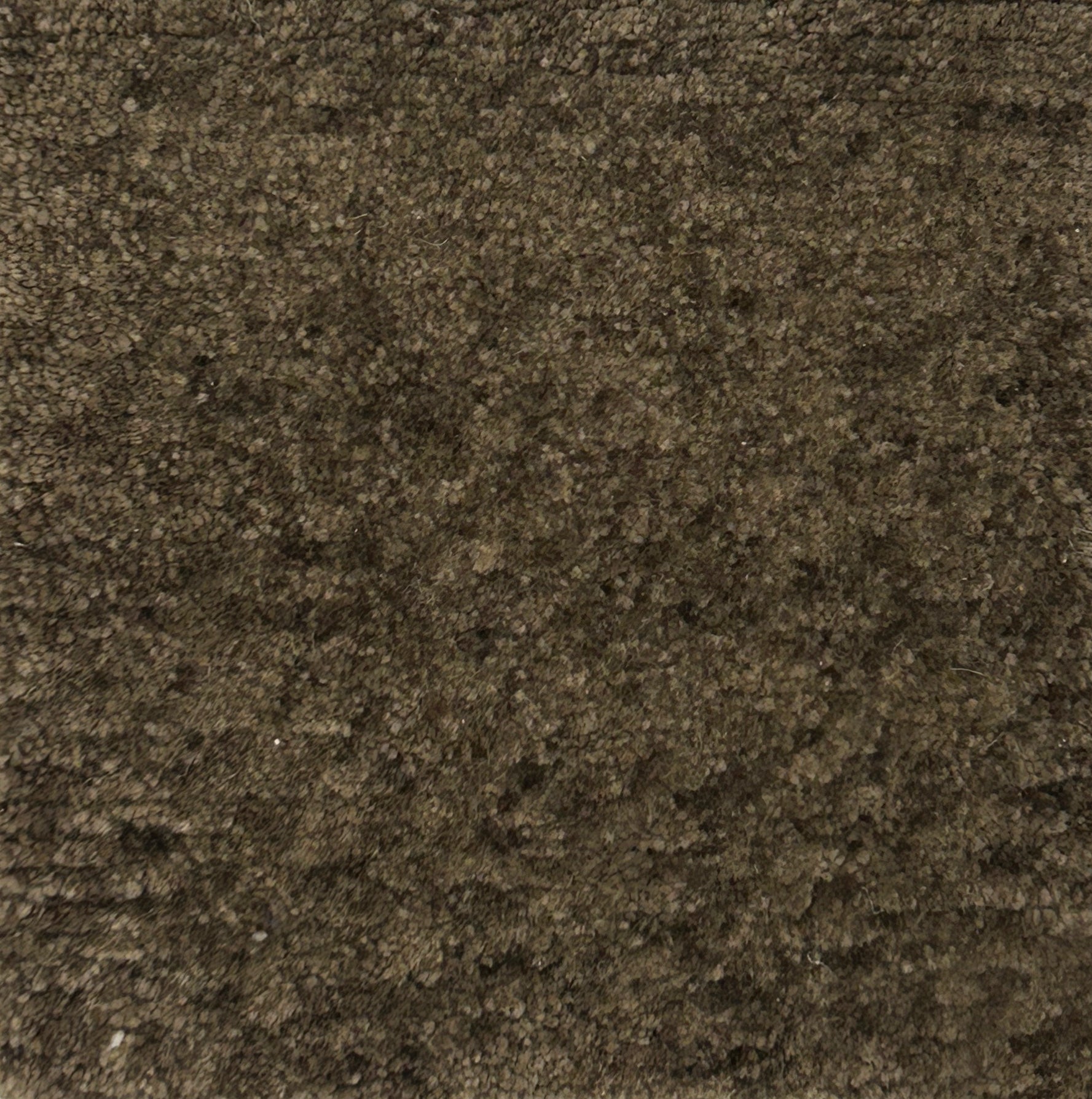 Handknotted carpet in brown with cut pile.