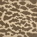 Handknotted rug with giraffe spot motif in light brown on cream. 