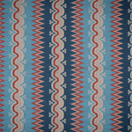 Handwoven silk fabric with zigzag and wavy designs in blue, red, and beige.