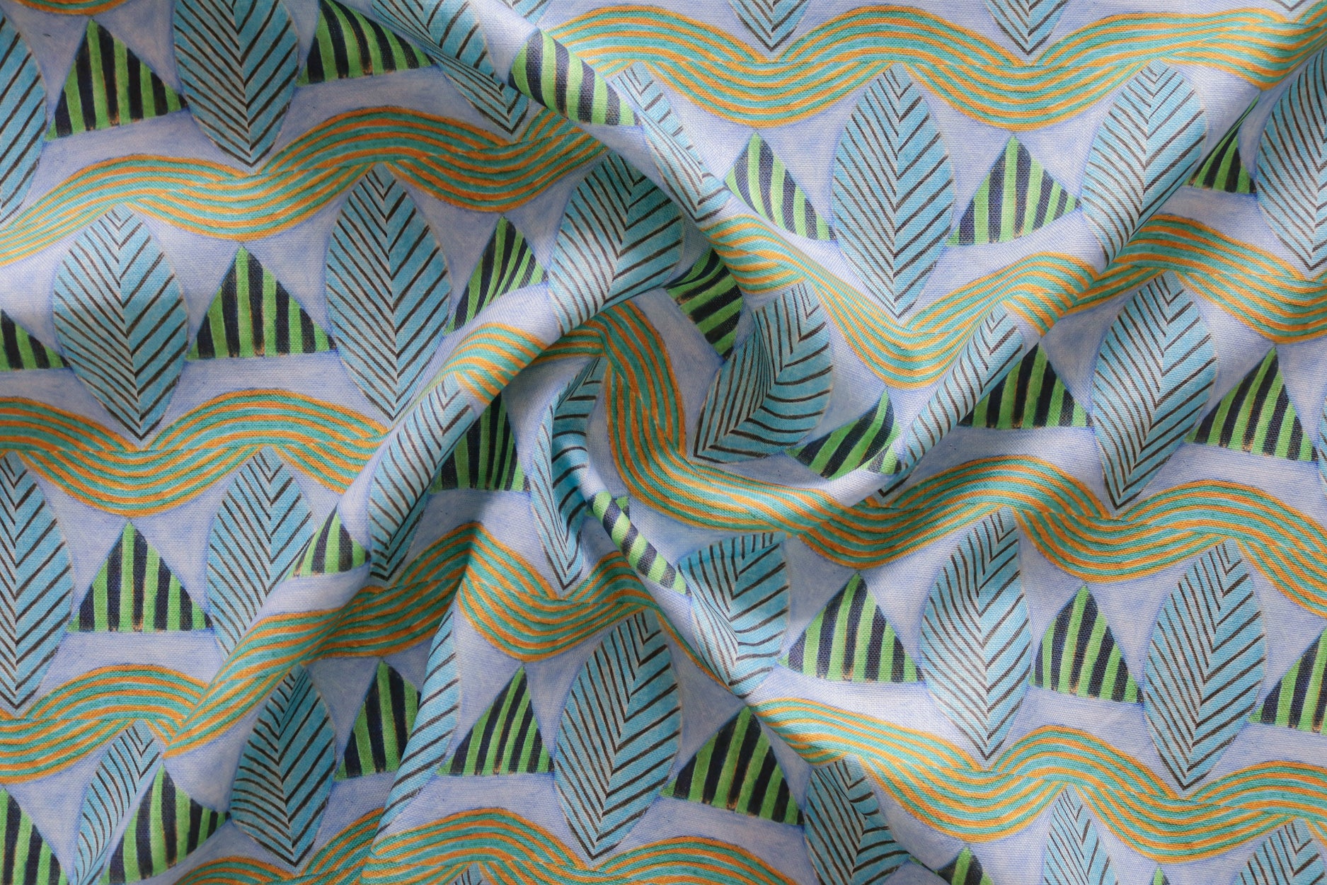 A close-up of a gently draped patterned fabric featuring repeating rows of stylized green leaves and wavy olive-yellow lines, striped blue and green triangles on a pale purple background.