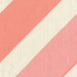 Fabric in a large-scale diagonal stripe print in shades of pink on a cream field.