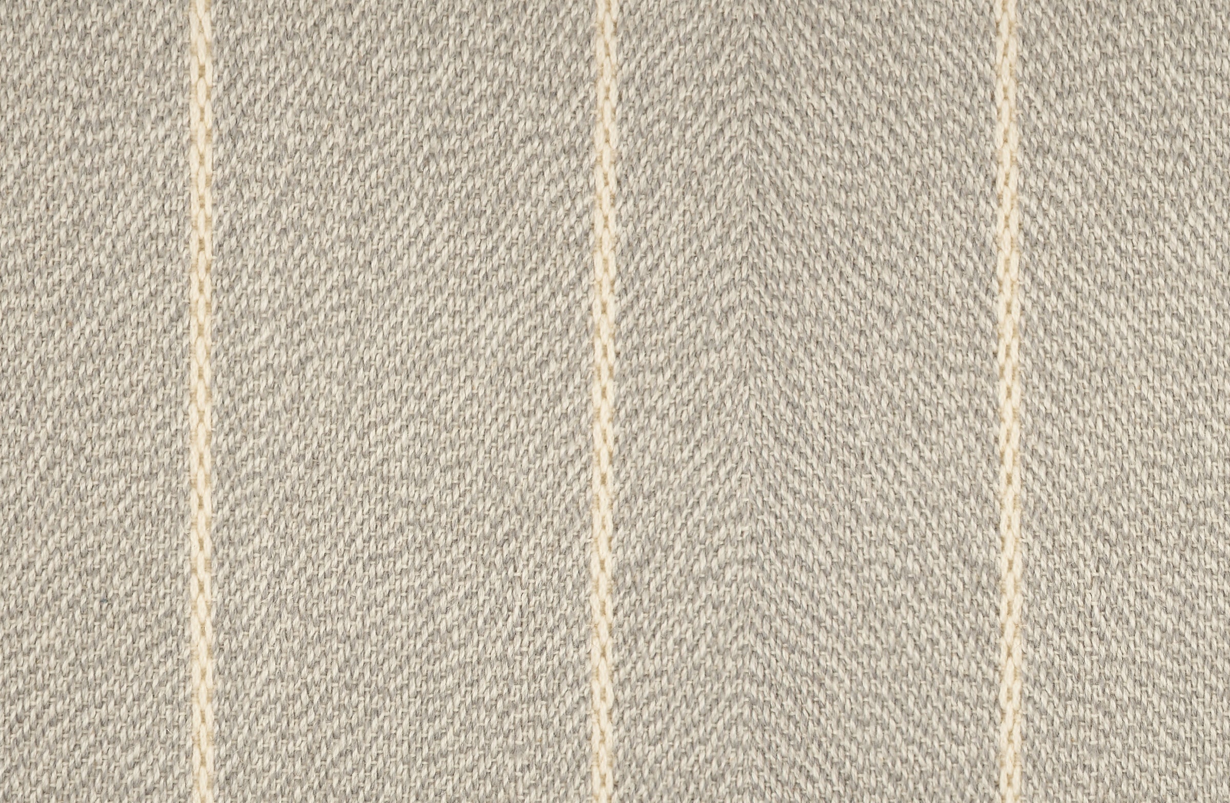 Broadloom carpet in a thin ivory stripe on a field of light grey.