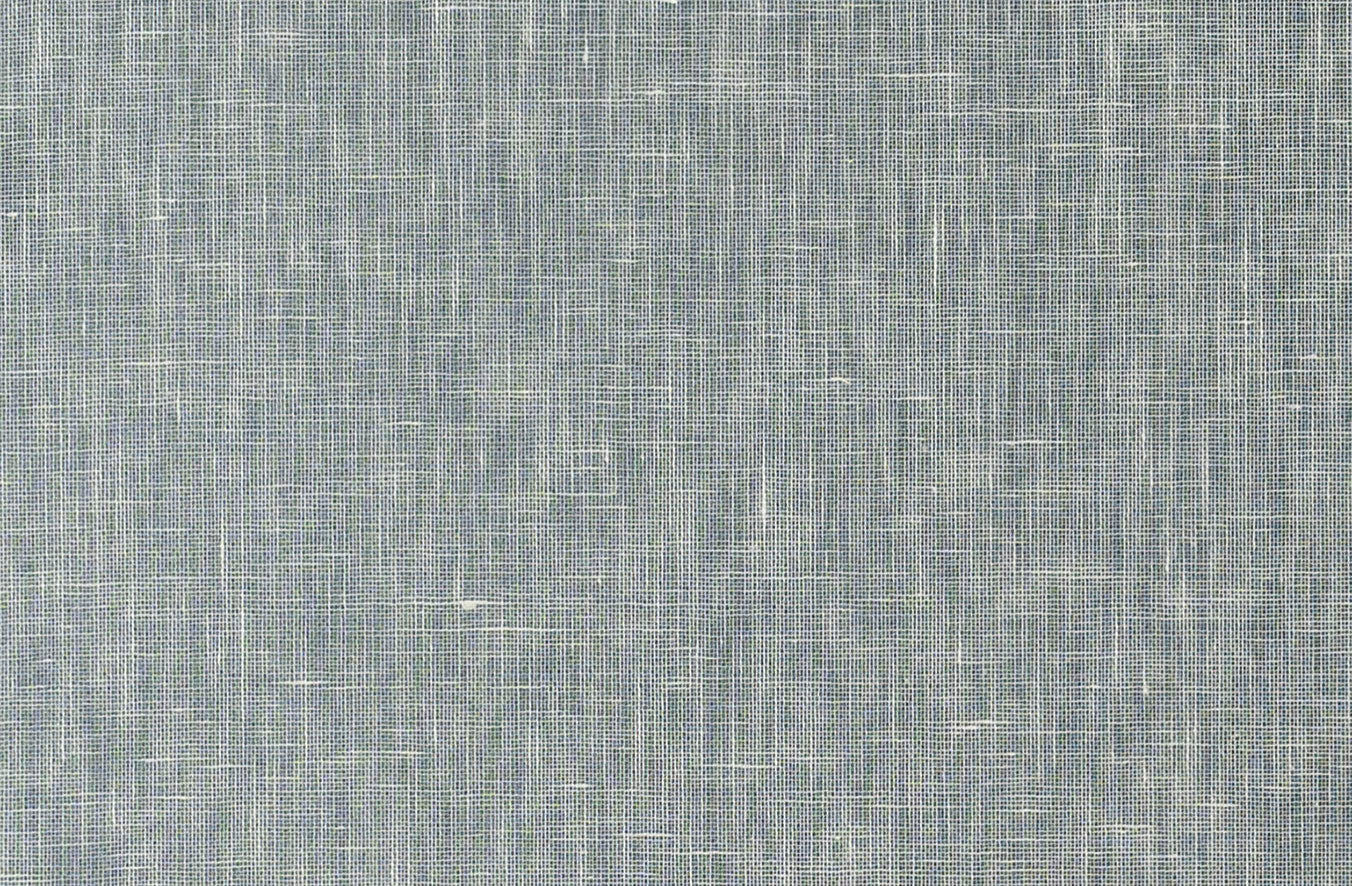 Detail of a grasscloth wallpaper in textured steel blue on a paper backing.